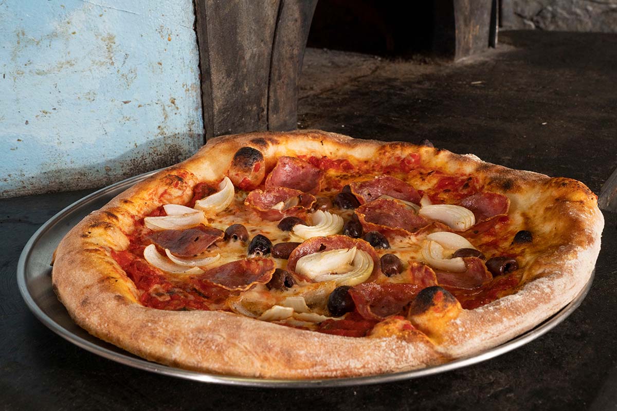 Pepperoni black olive onion pizza