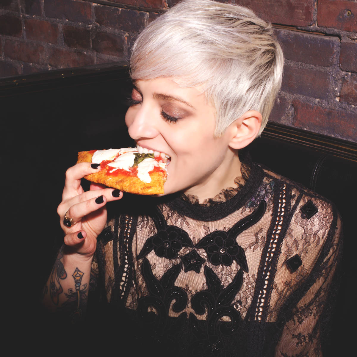 woman enjoying a slice of pizza