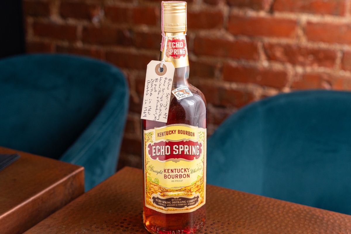 bottle of 1964 Echo Springs bourbon on a table
