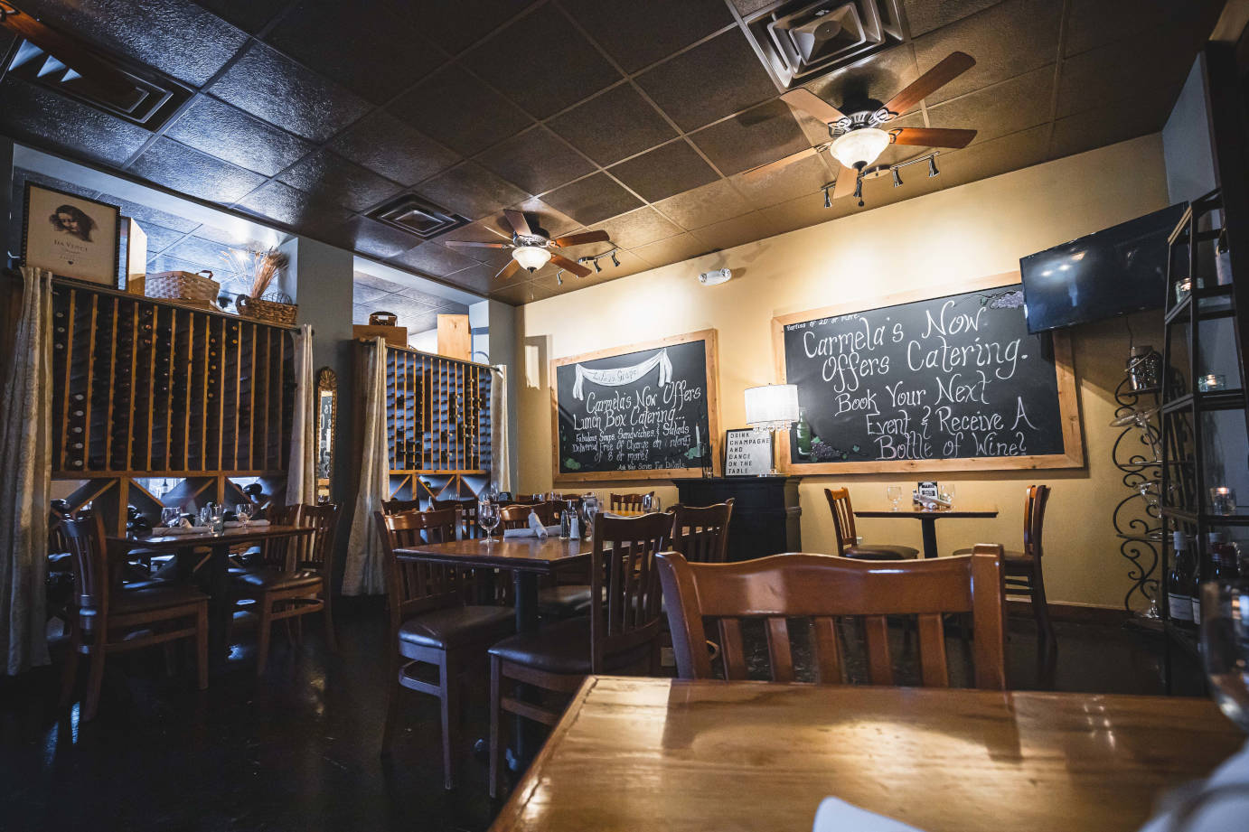 Interior, tables and chairs, wine rack, wall chalkboards