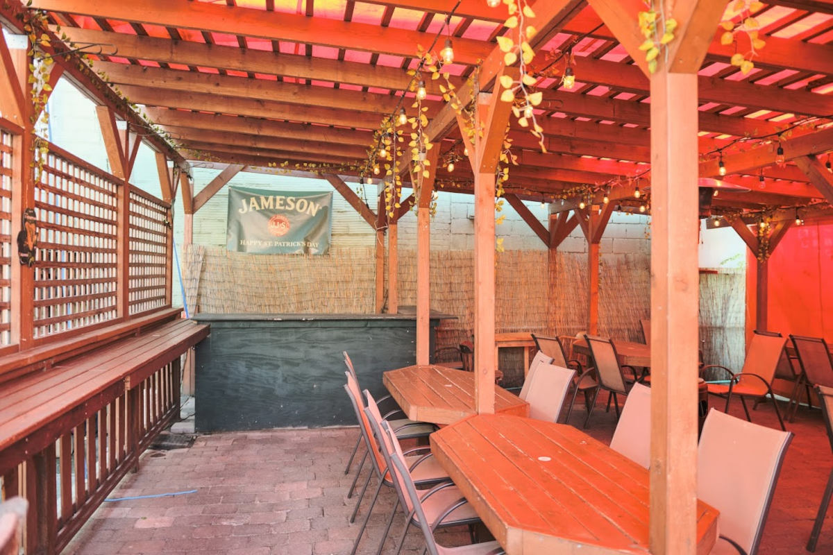 Covered patio with tables and chairs