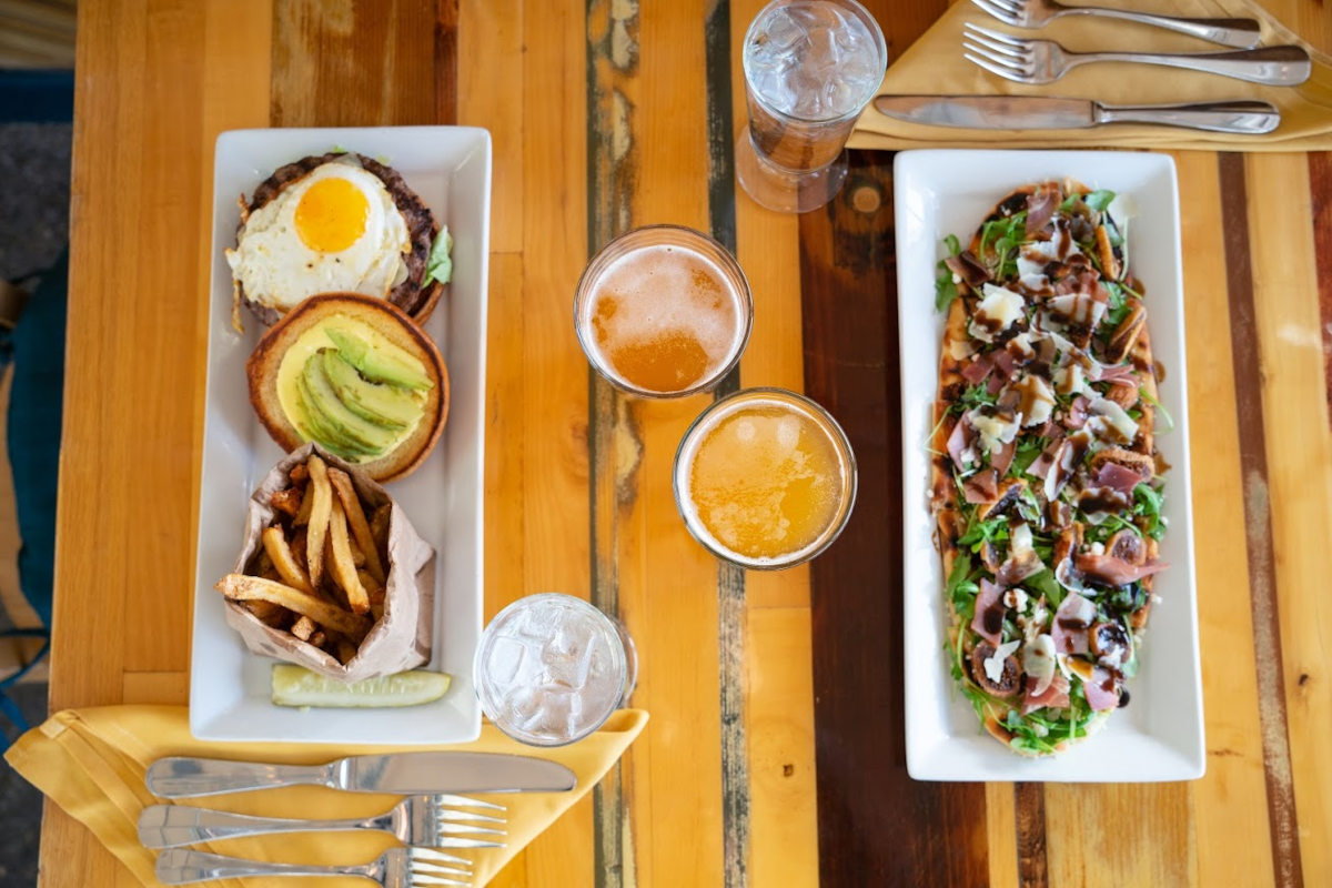 Prociutto flatbread and sunny side burger with craft beer