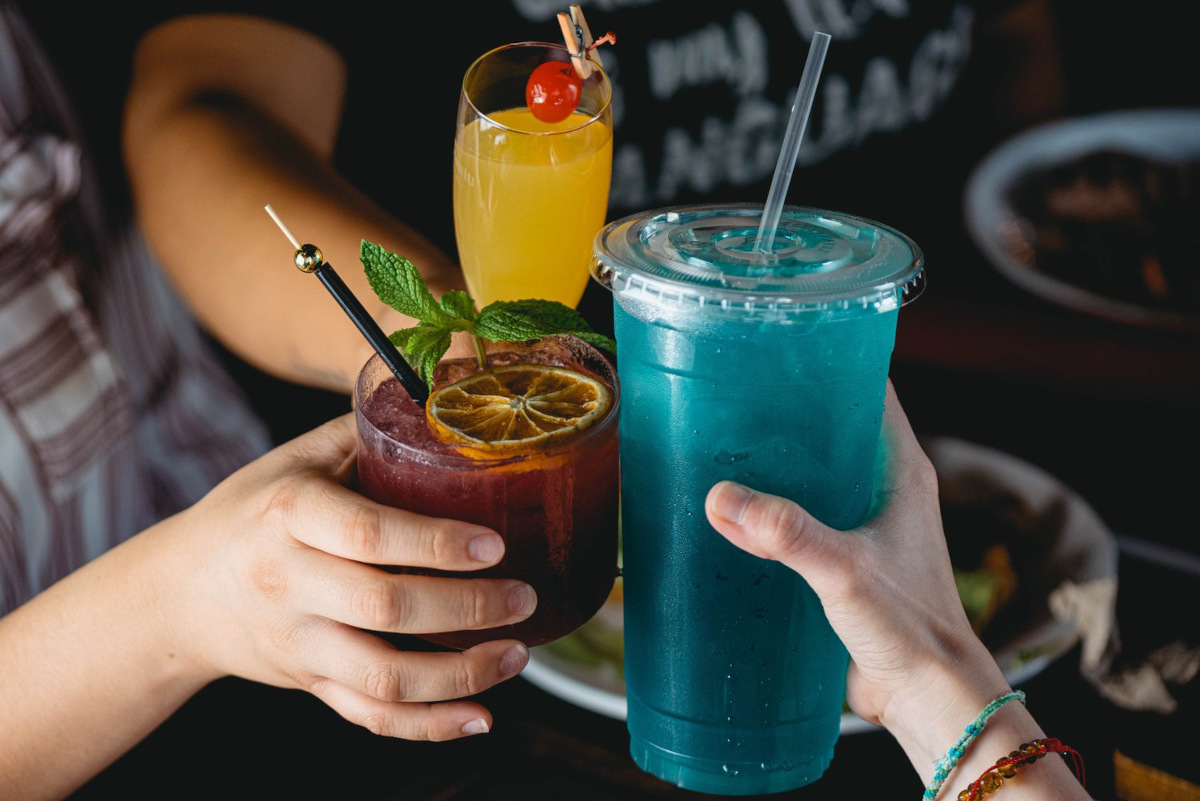 People toasting with cocktails