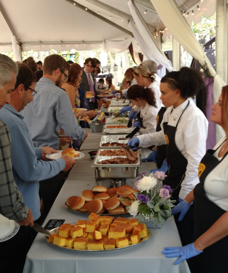 a group of people at a buffet.