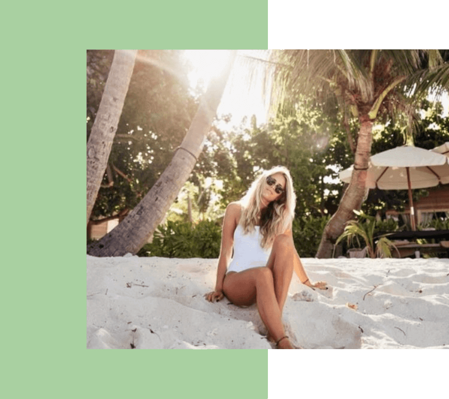 Girl sitting on tha sand beach