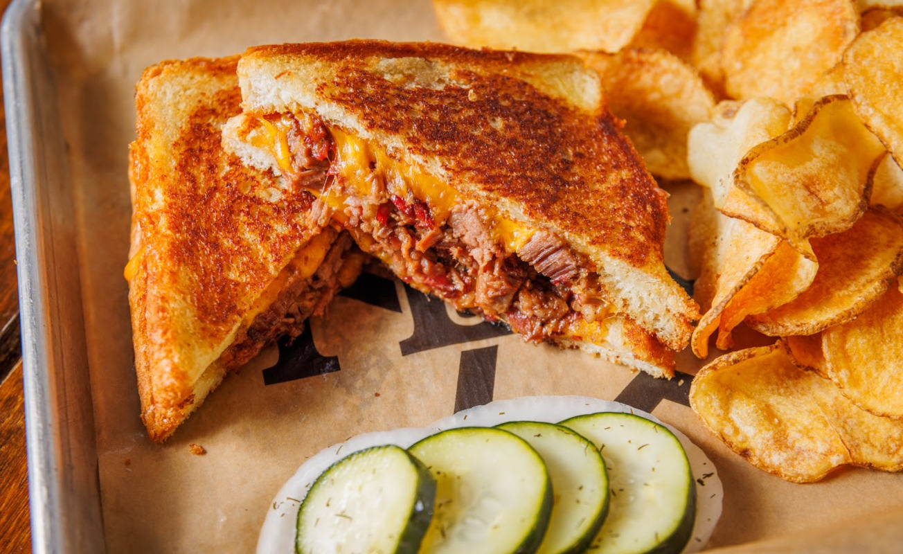 Brisket Grilled Cheese Sandwich and chips