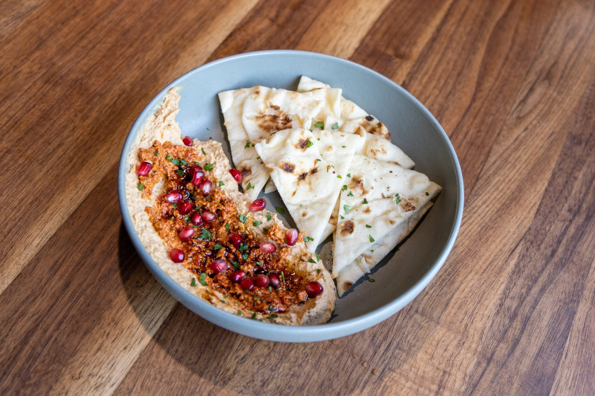 roasted garlic hummus with pomegranate and roasted red pepper