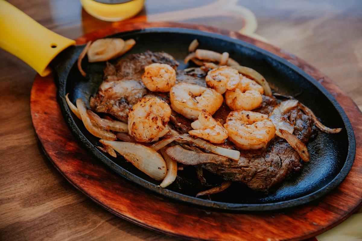 Shrimp atop steak