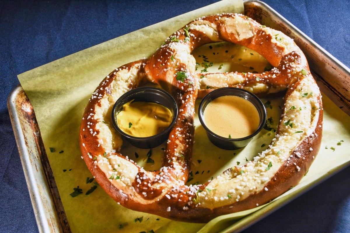 Large pretzel served with beer cheese and mustard dip