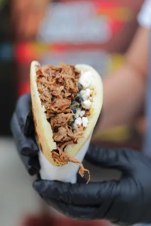 A shredded beef brisket arepa, by Anytime Arepa