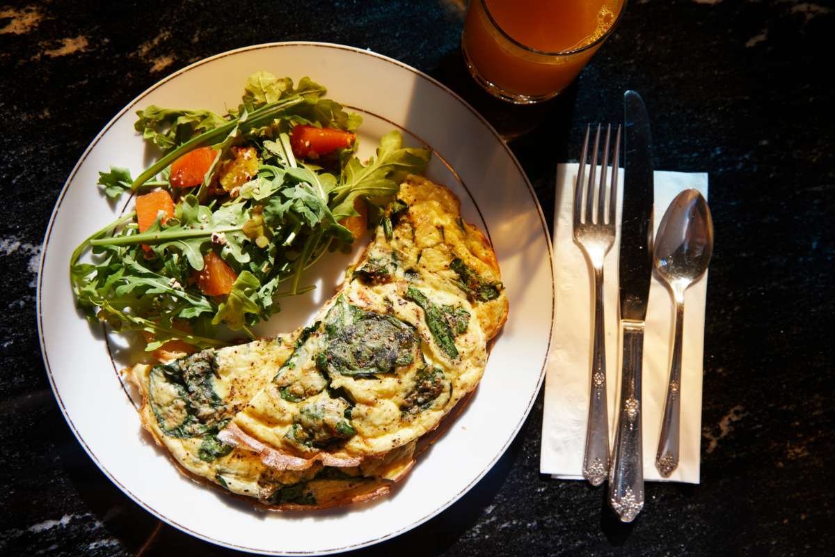 Spinach omelet with arugula salad on a side