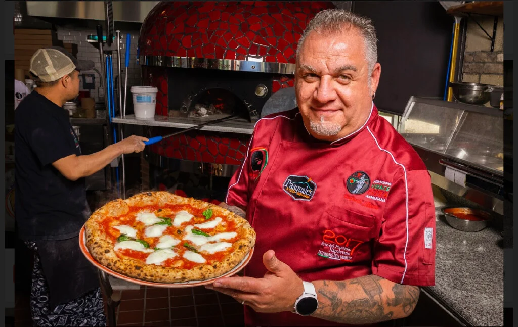 Chief Pasquale Illiano holding pizza