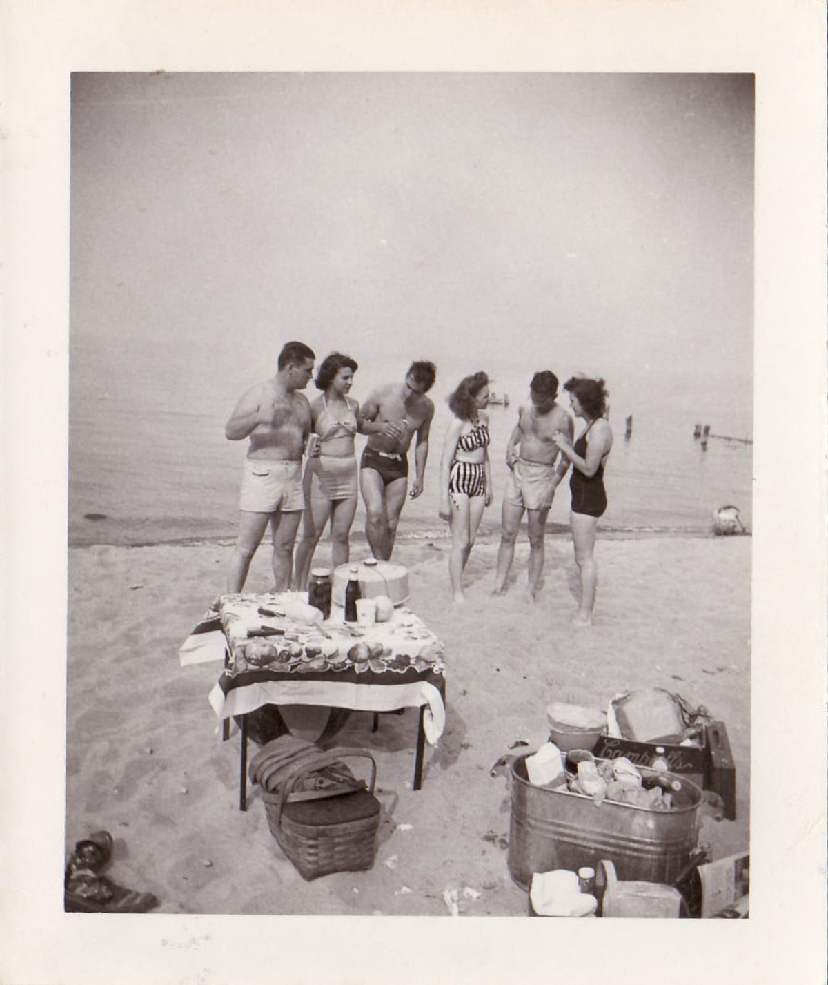 black and white photo of beach picnic