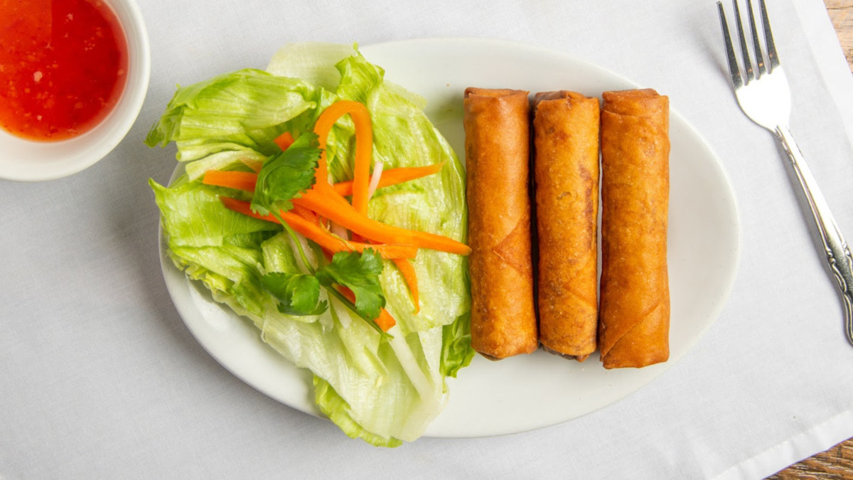 Spring Egg Rolls served with some lettuce and shredded carrot