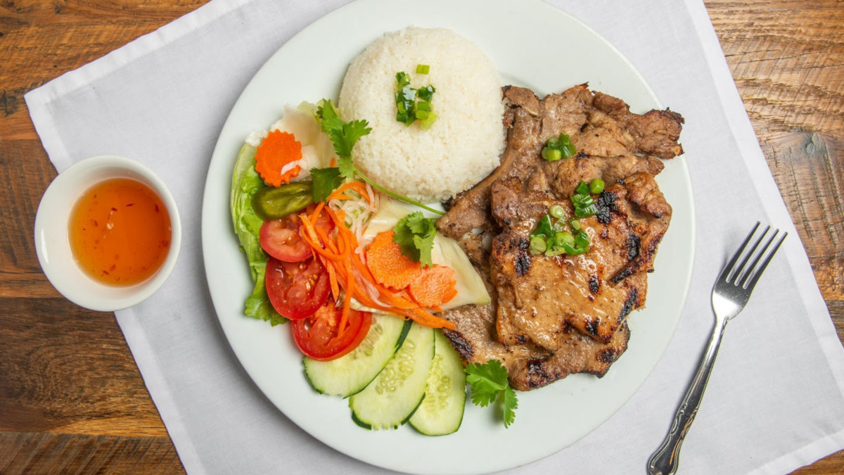Steak served with white rice and veggies