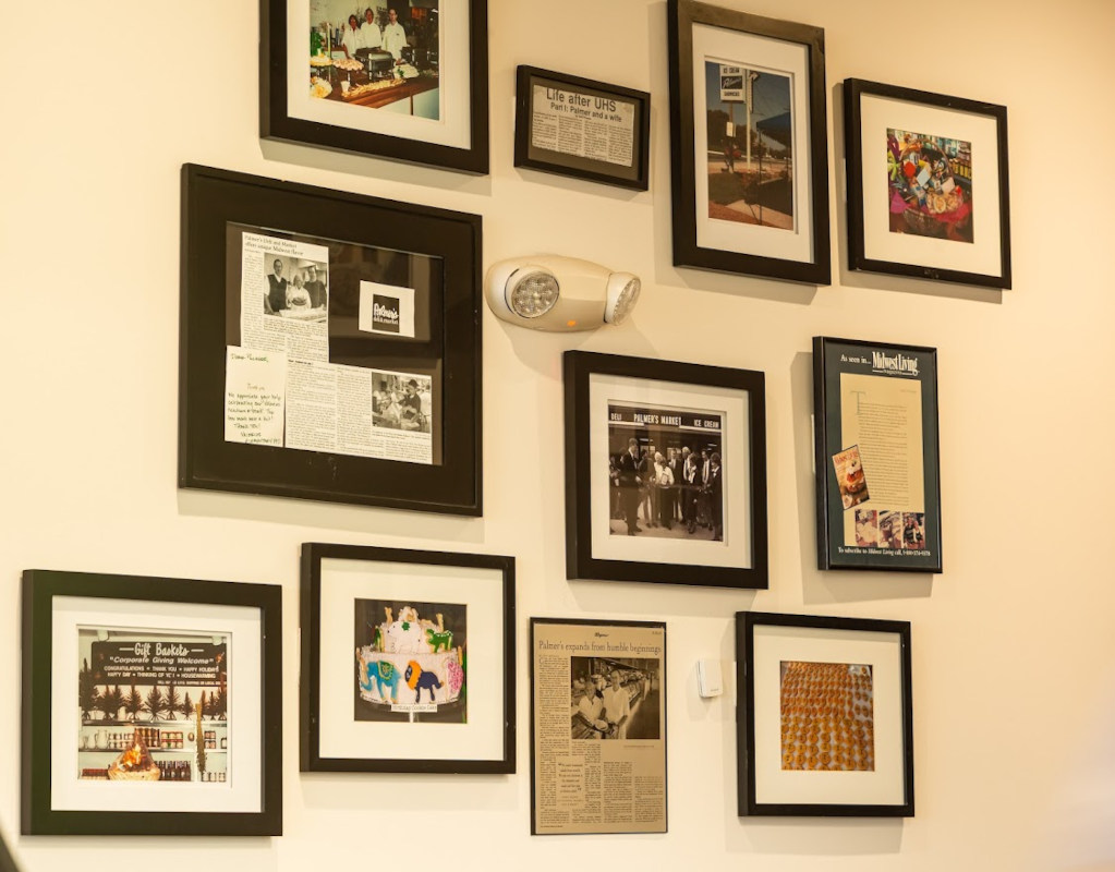 Interior, framed pictures and press articles on a wall