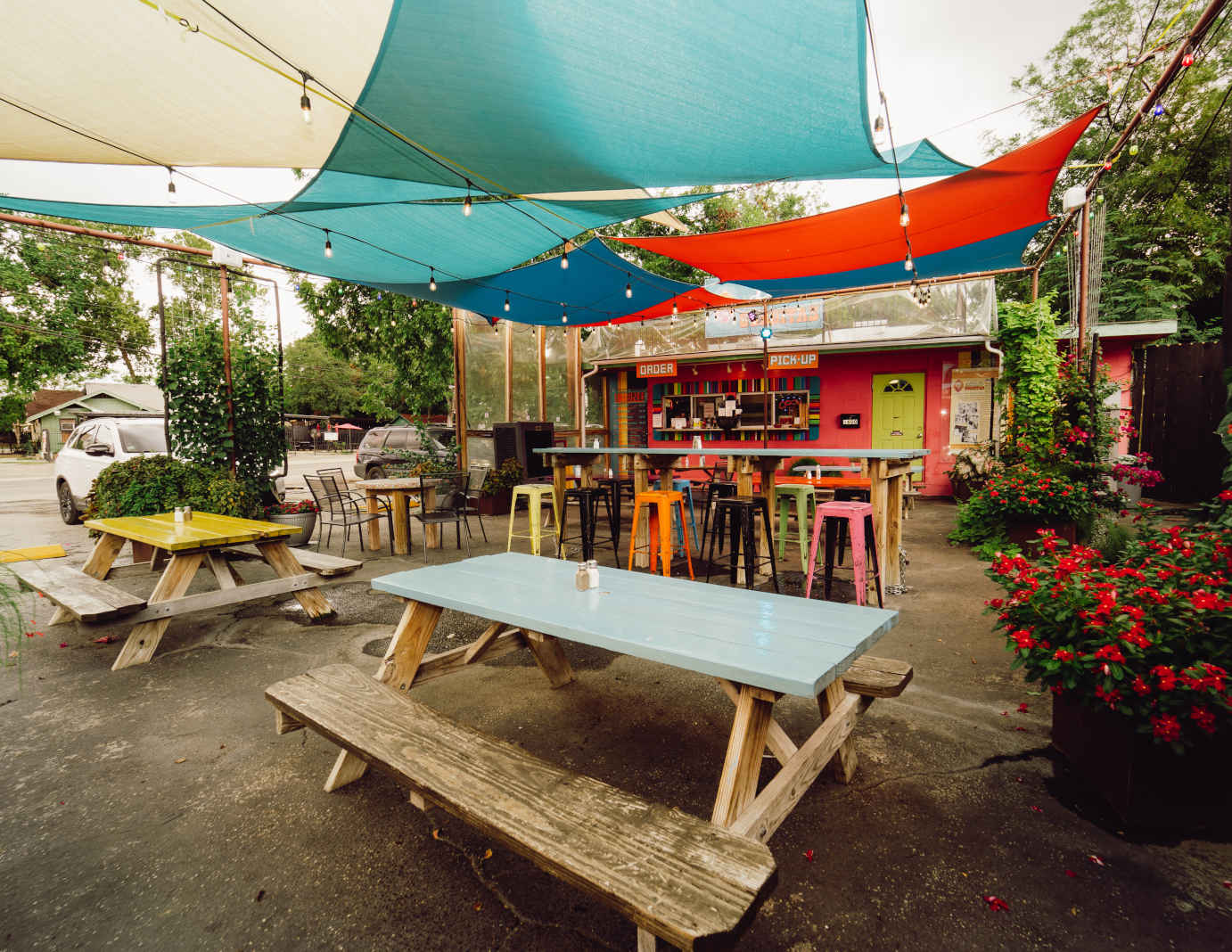 Outdoor seating area covered with sun shade sails