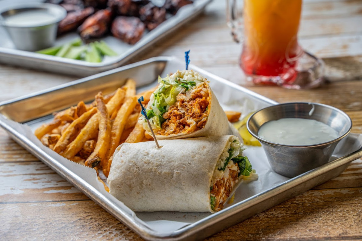 Buffalo chicken wrap, fries and sauce dip