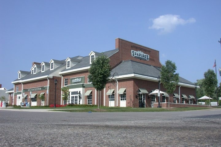 a brick building with a large white sign