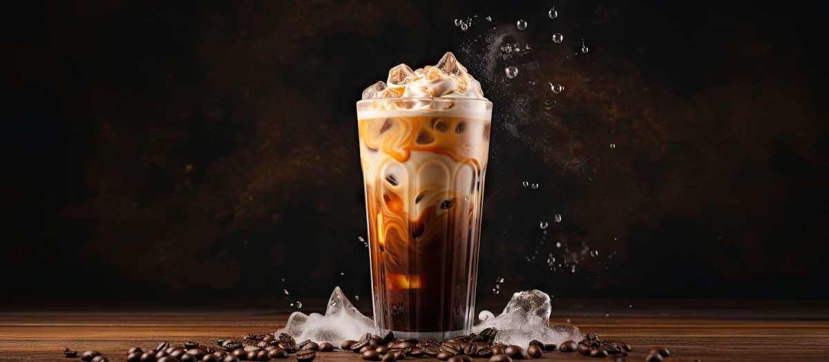 an iced coffee with ice and coffee beans