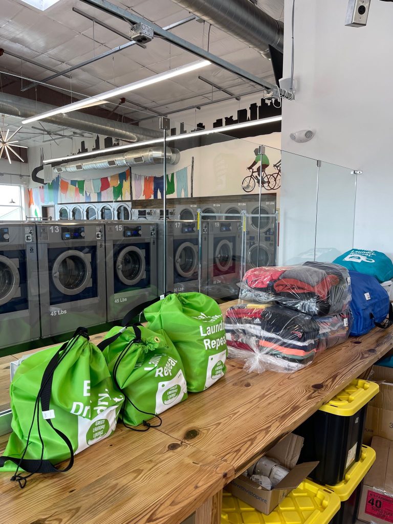 Laundry room, bags with laundry and folded clothes 
