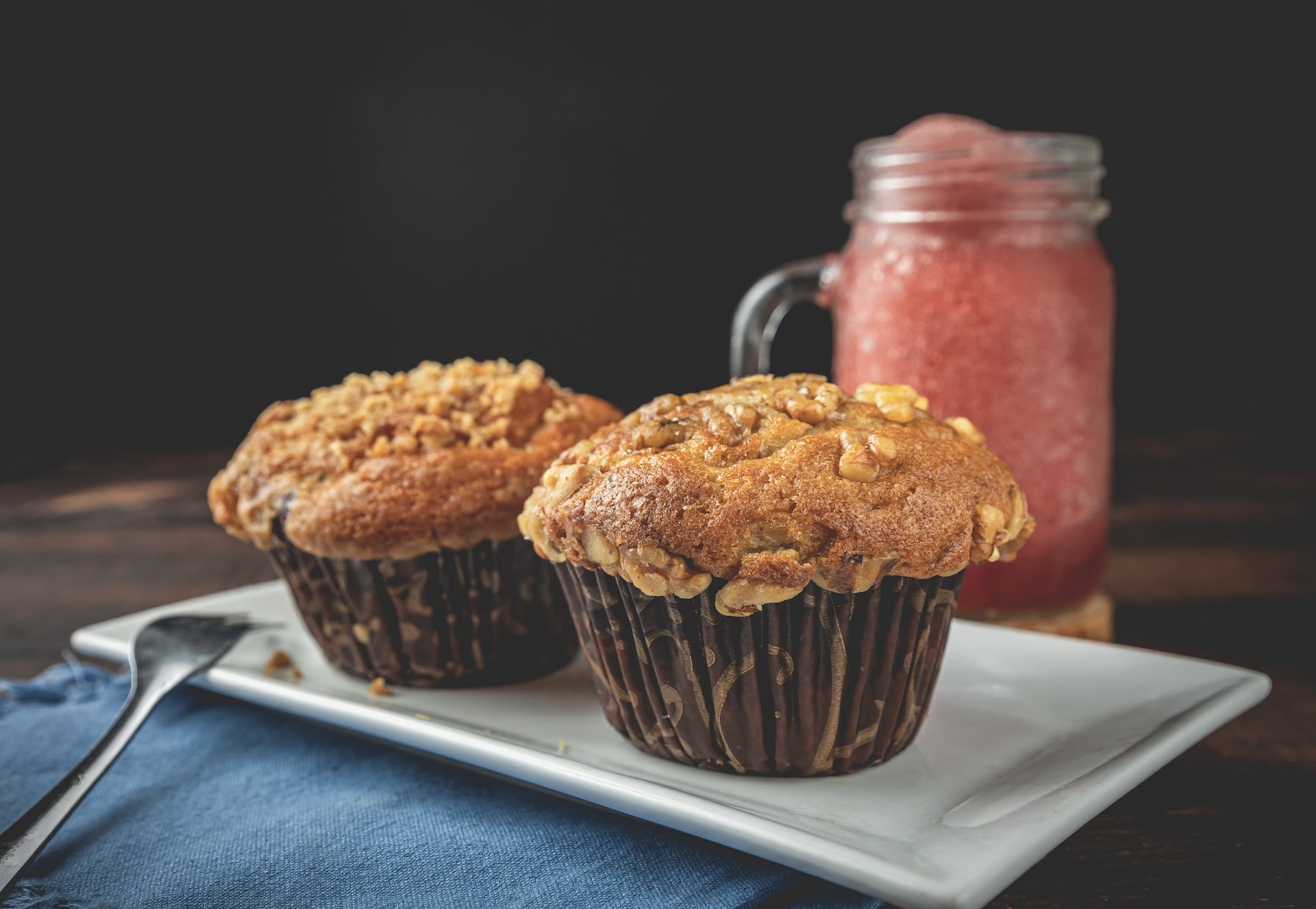 Muffins and a glass of frozen berry beverage