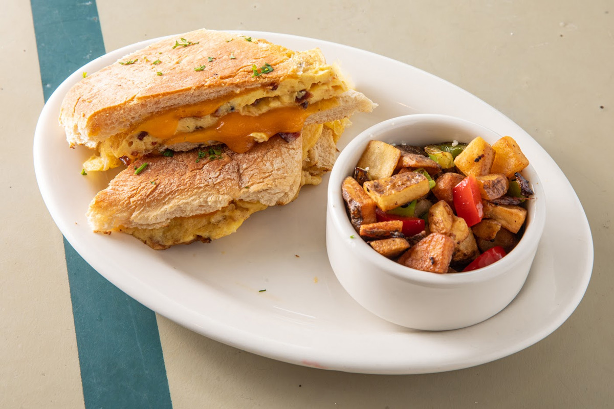 Breakfast panini, served with a side of roasted veggies