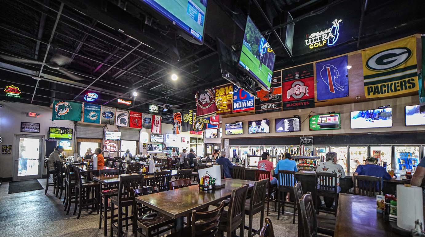 Interior, bar, tables, chairs, sports decorations