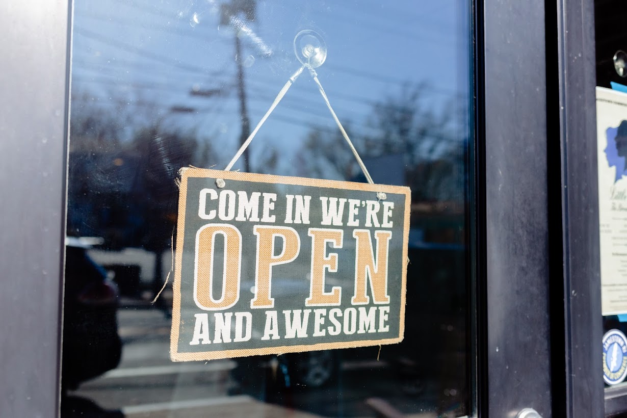 Outside, open sign on the entrance window