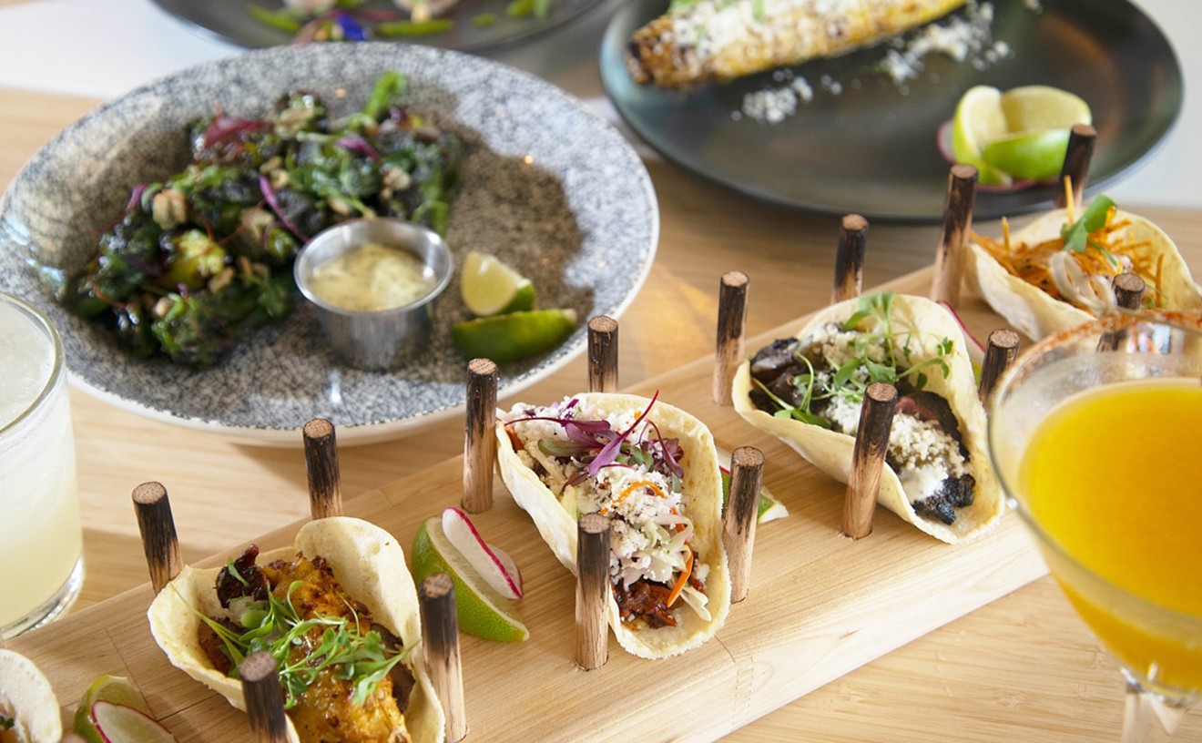 Taco board and various types of dishes on the table