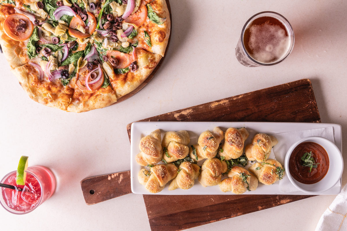 Garlic knot, pizza and cocktails