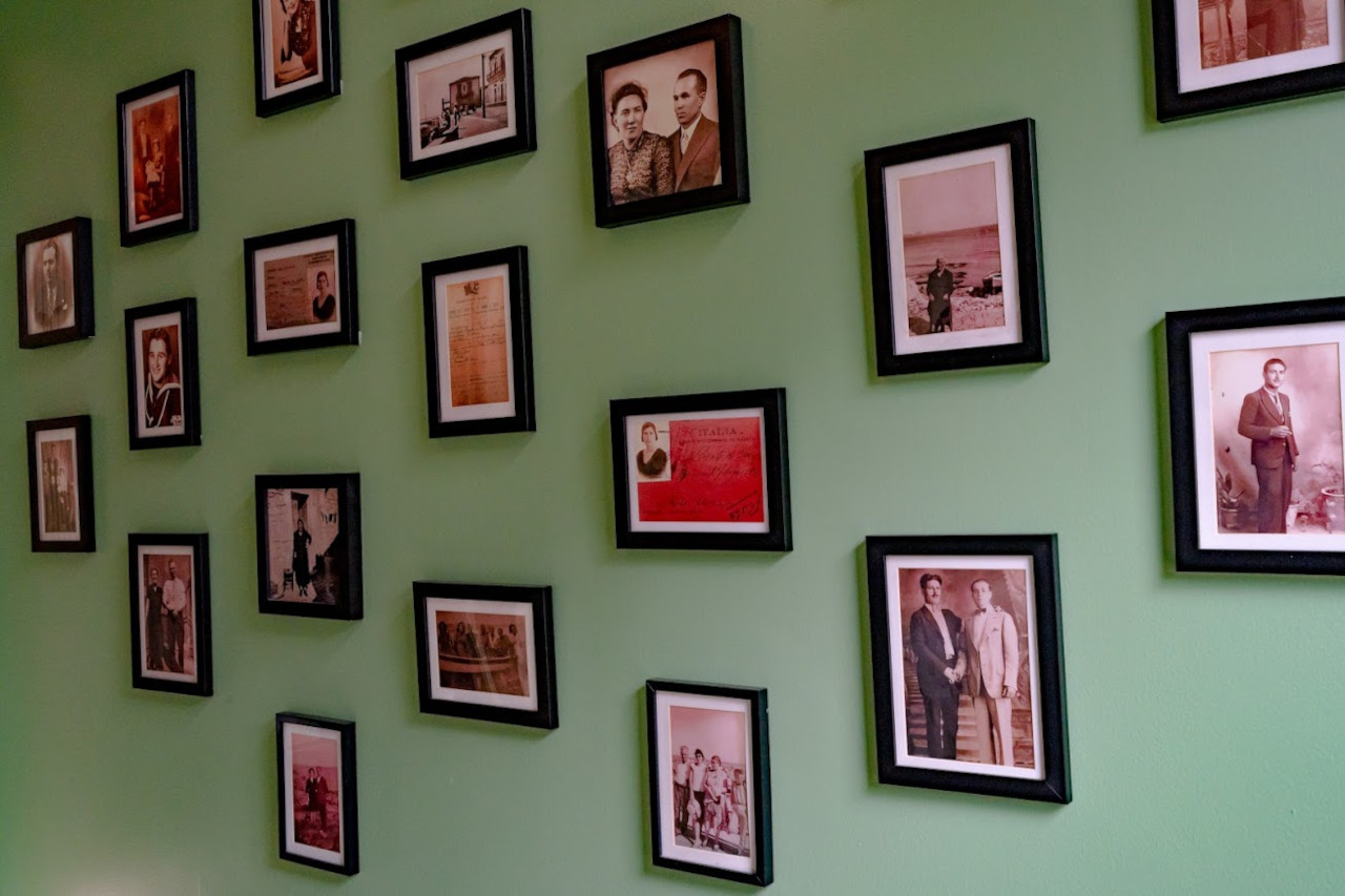 Numerous framed photos on the wall