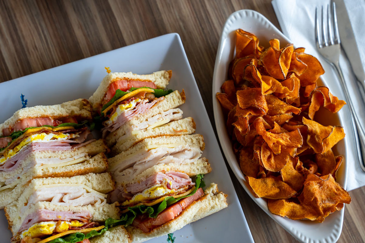 Country Club Sandwich and a side of sweet potato chips