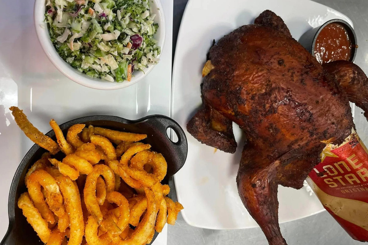 Beer can chicken with curly fries and slaw