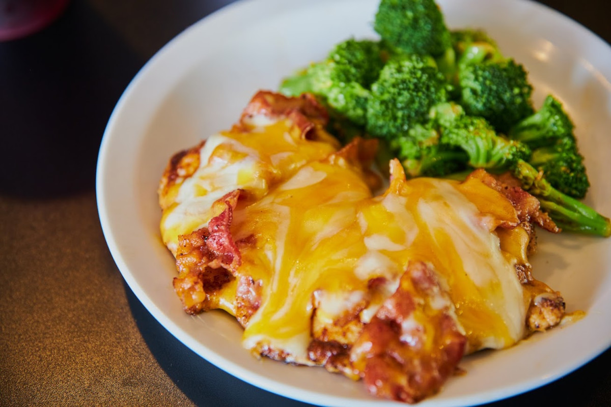 Smothered Chicken with mixed cheese and bacon with broccoli