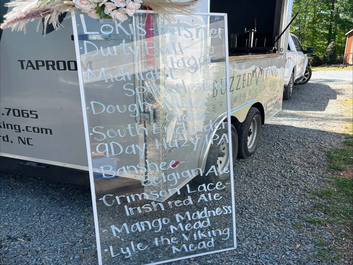Mobile Taproom Cart with a bar menu board placed in front