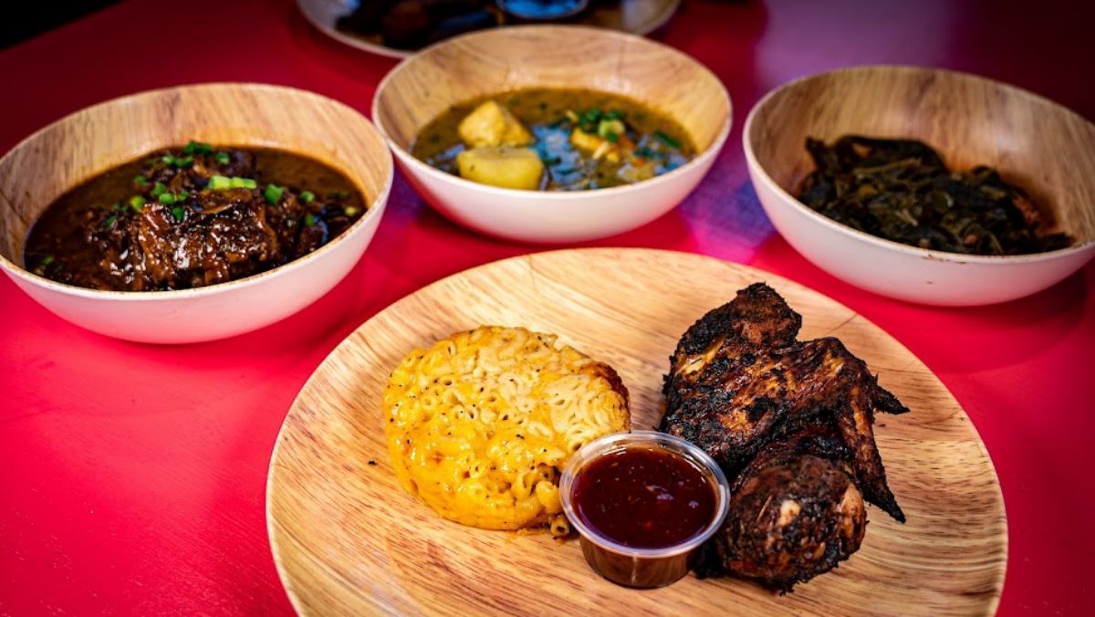 Grilled Chicken served with Mac and Cheese, BBQ sauce and three different side dishes 