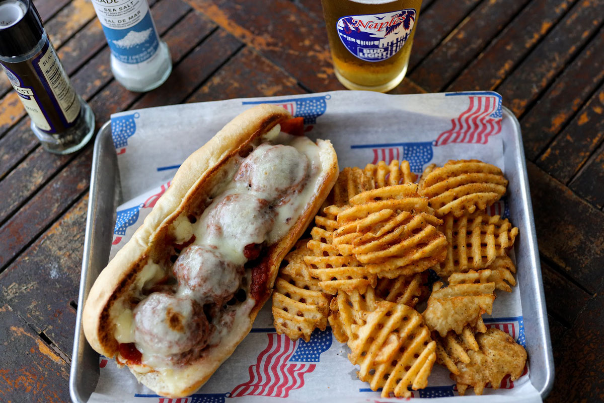Meatball Sub with fries and beer