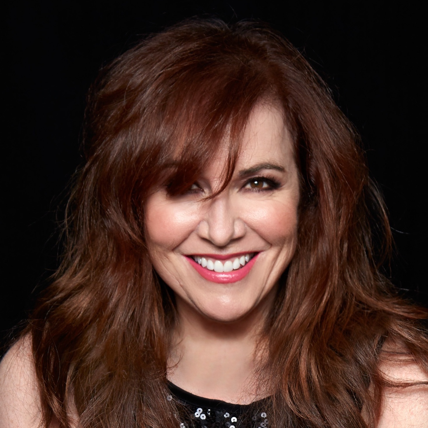 Close-up portrait photo of Debbie Gravitte