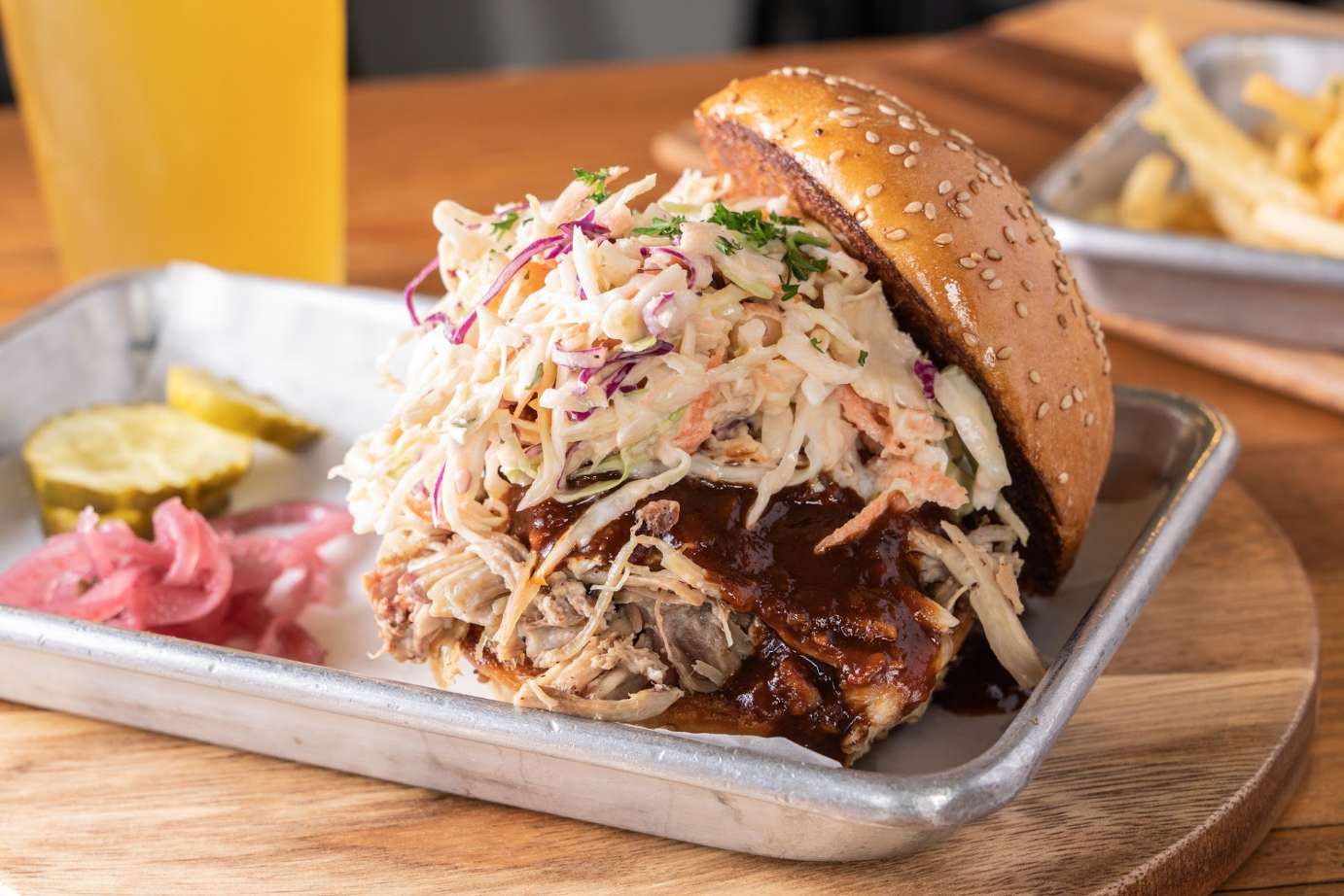 Pulled pork sandwich with coleslaw and BBQ sauce