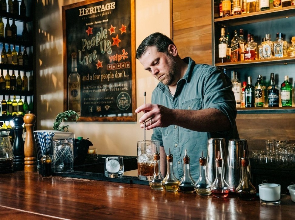 Photo of Chris Brende making a cocktail