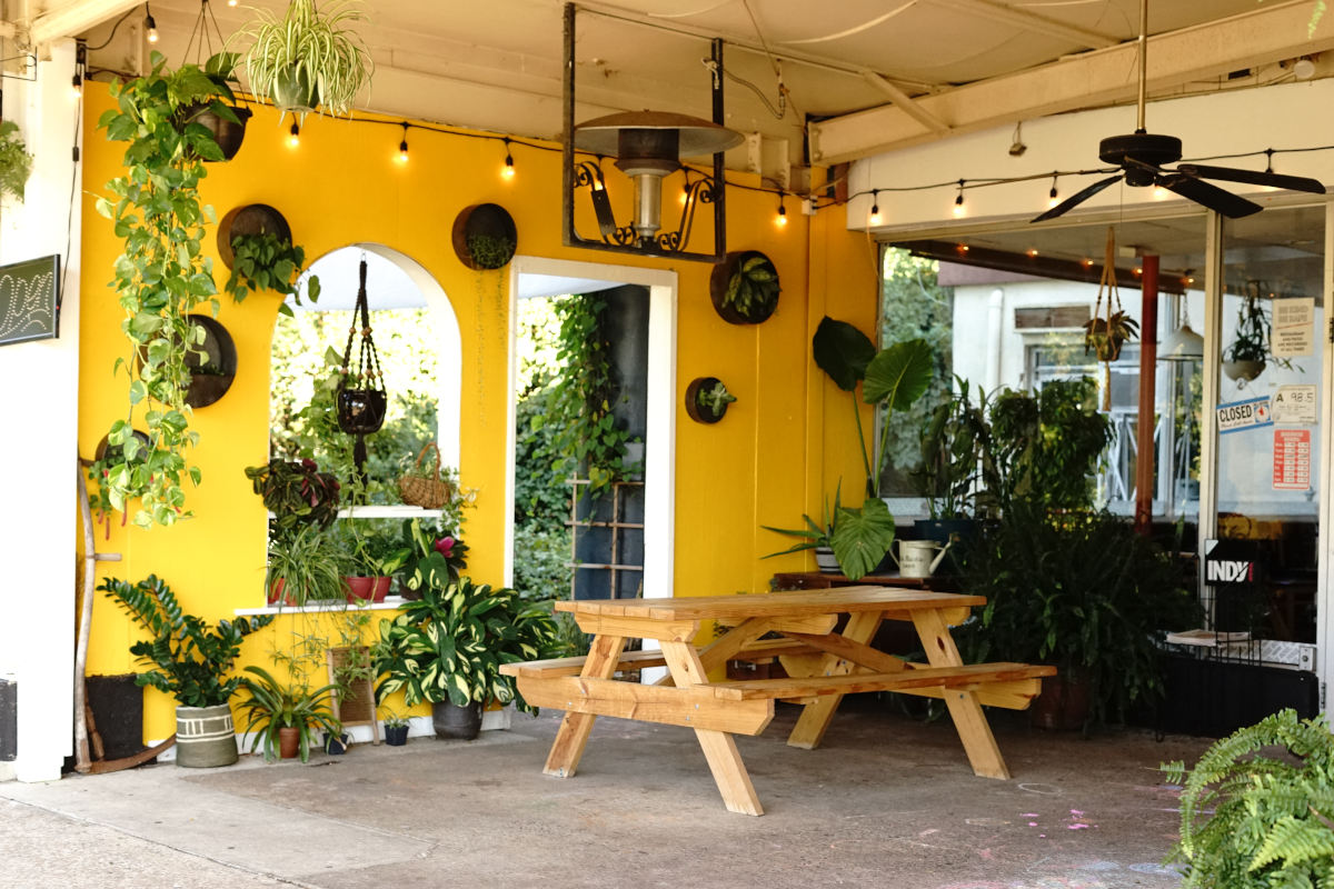 Patio seating area decorated with plants and flower pots