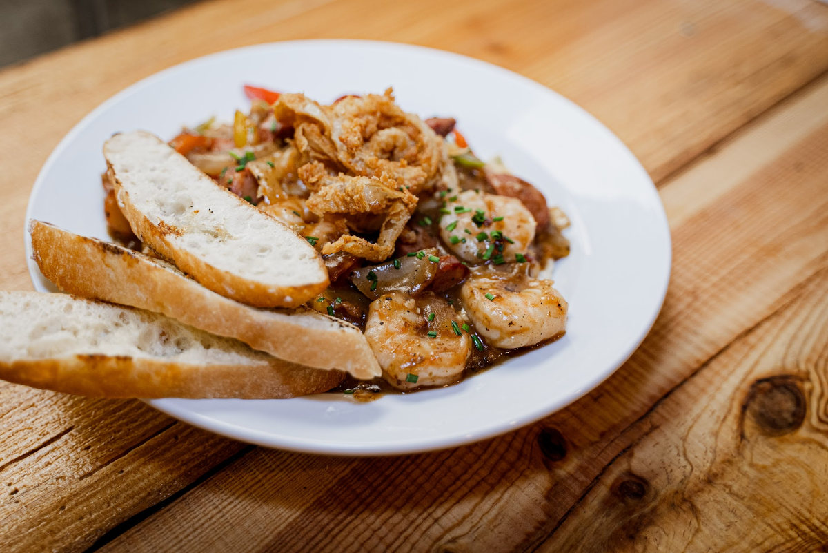 Tassos shrimp and grits on plate