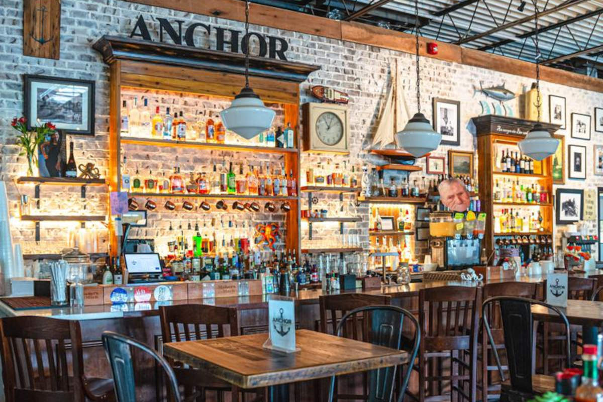 A bar with a table and chairs