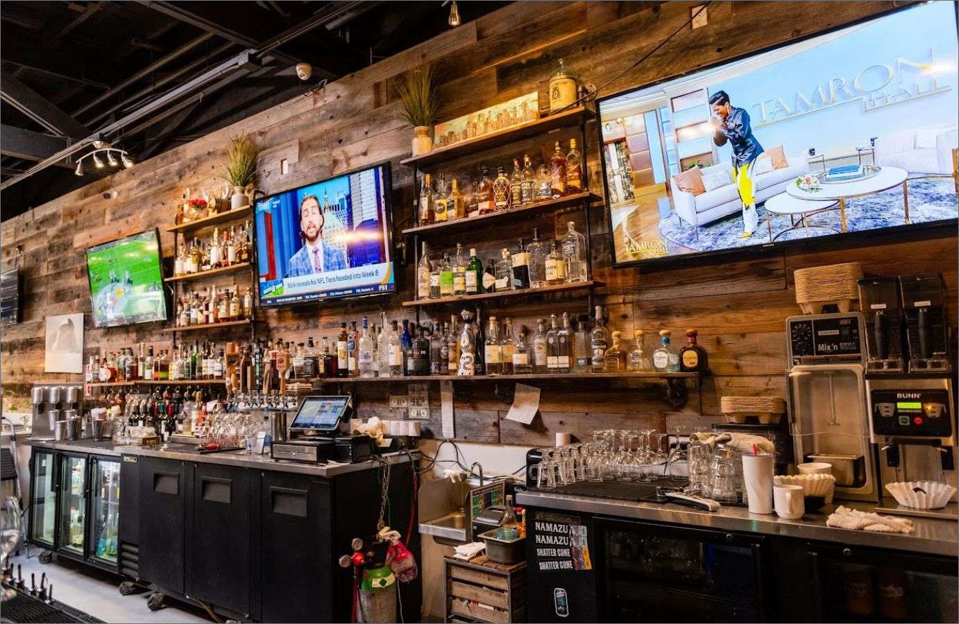 bar interior wall with drinks and tvs