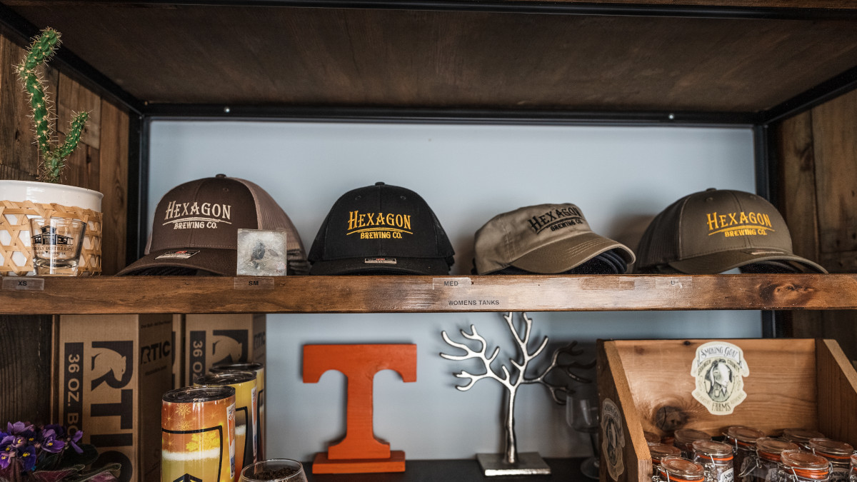 Baseball caps on a shelf