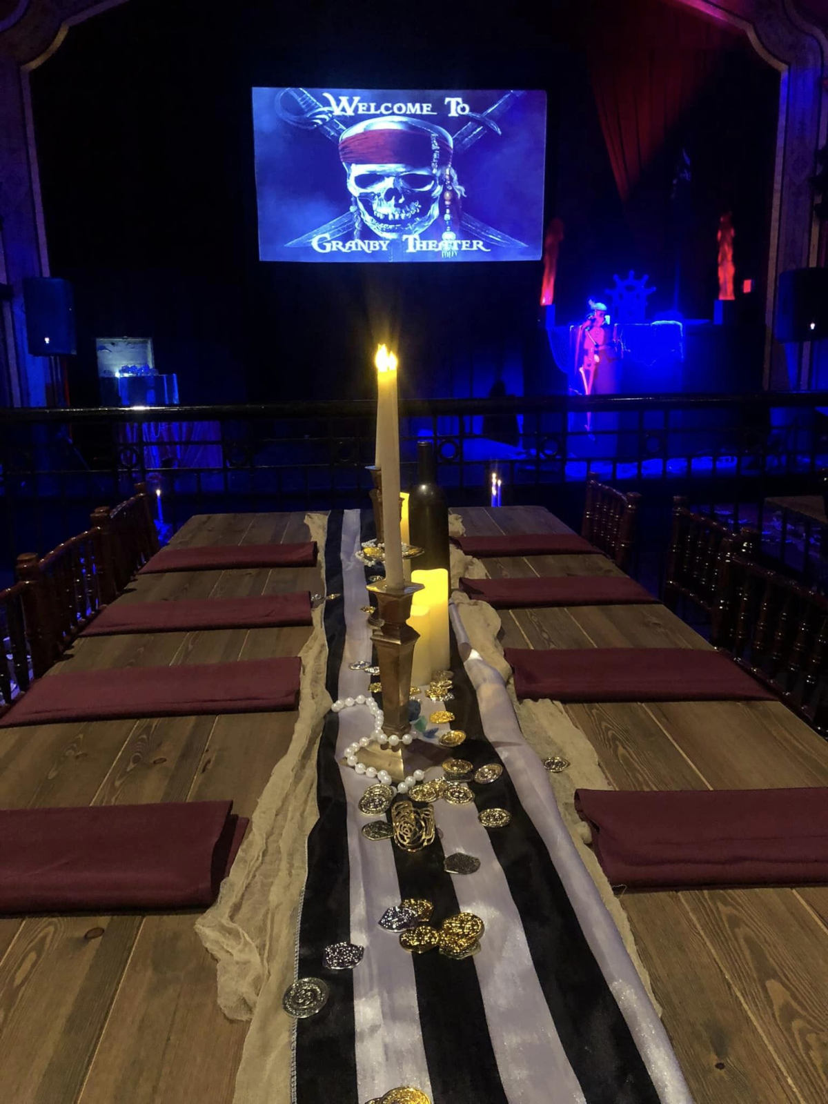A long decorated table setting for Pirates of the Caribbean themed event