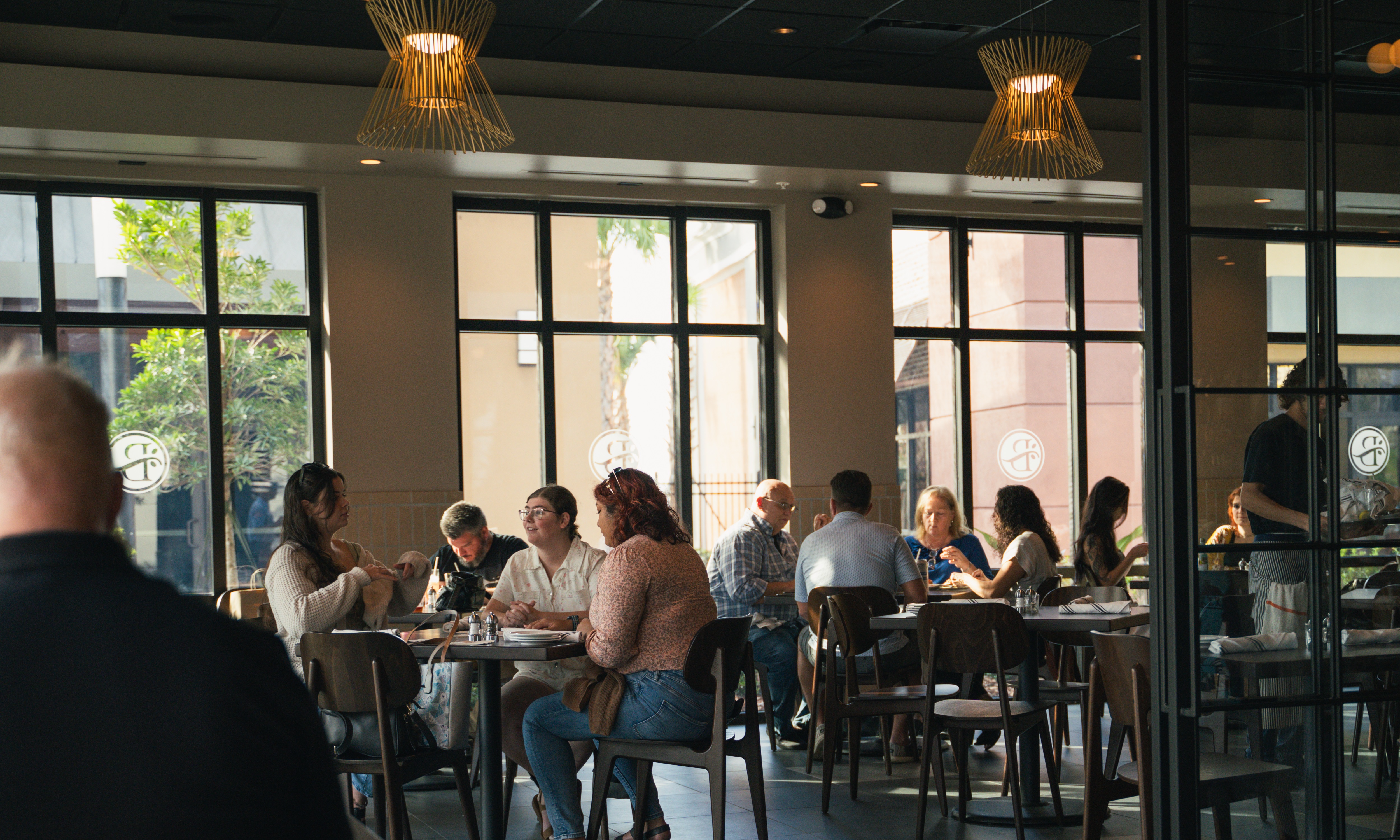 Room full of people dining