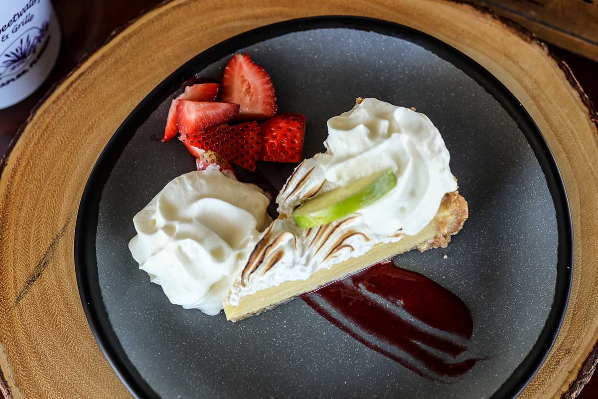 Key lime pie with coffee, top view