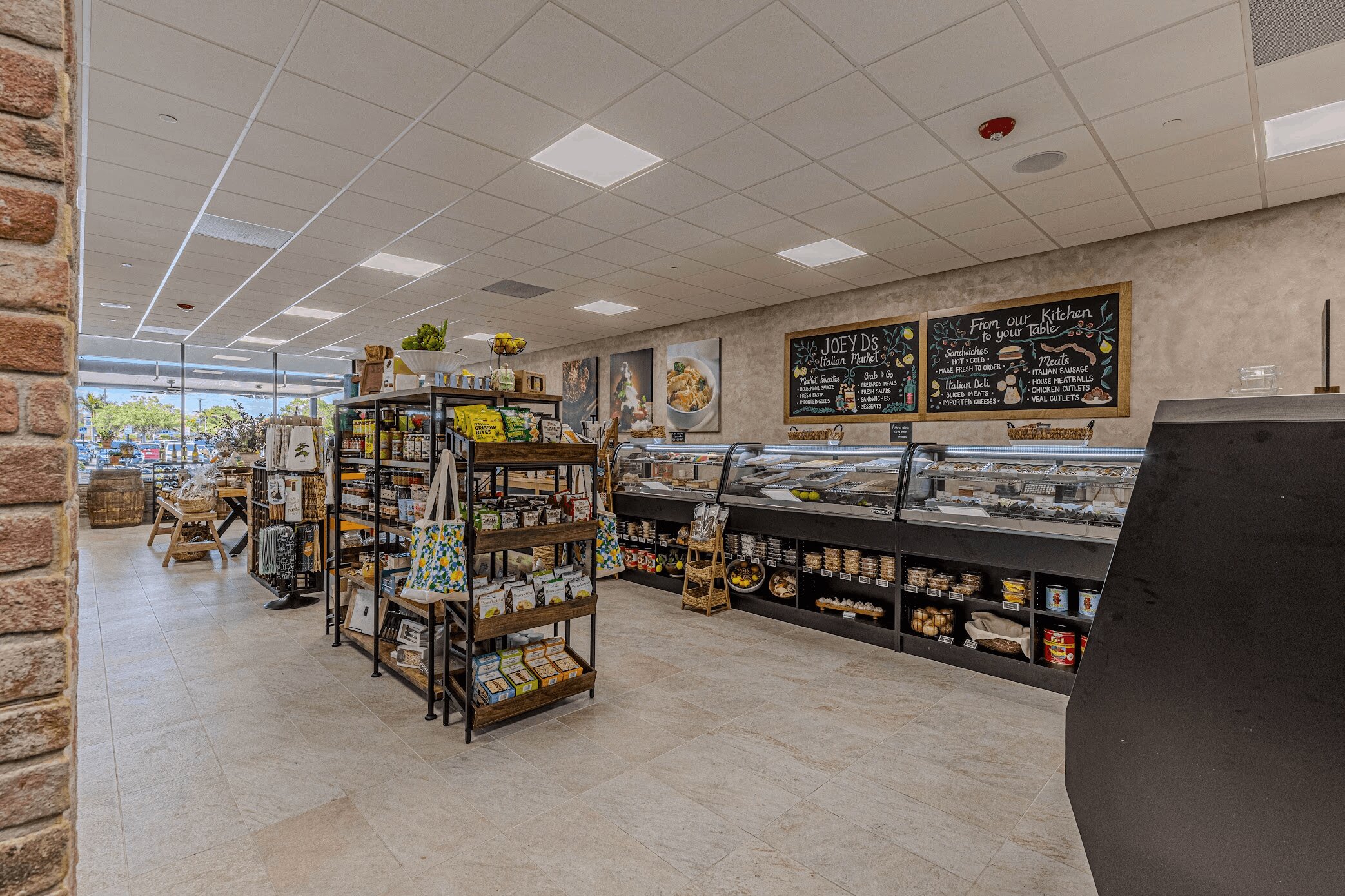 Market entrance with refrigerated cases and chalkboard menus